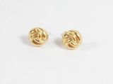 une paire de boucles d'oreilles dorées ornées d'un motif en nœud