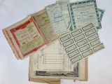 some old papers are stacked on top of each other on a table