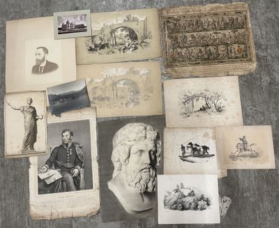 a lot of old photos on the floor of this room