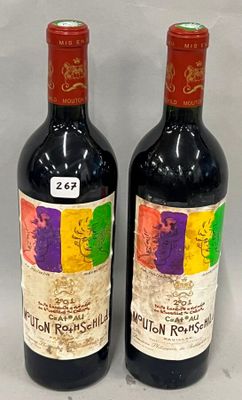 two bottles of red wine sitting next to each other on a table
