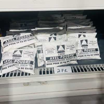 bags of food sitting on top of a shelf in a freezer