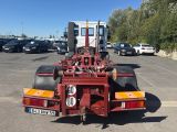 a large red truck that is parked in a parking lot