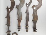 several different types of knifes are displayed on a white surface