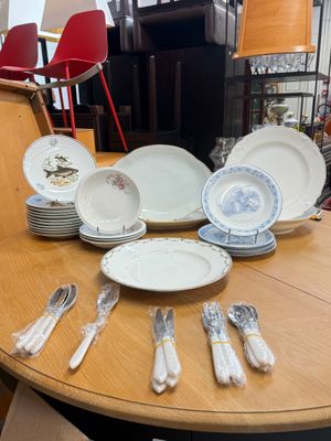 a table with a lot of plates and silverware on it