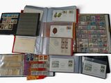a lot of stamps and envelopes sitting on a table