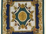 a blue and gold square scarf with a medallion design