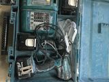a blue tool case with tools in it on a table