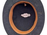 a black hat with a brown band around it