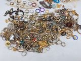 a pile of assorted jewelry on a table