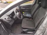 the interior of a car with the door open showing the driver ' s seat and dashboard