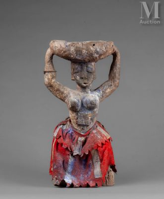 an image of a statue of a woman holding a basket on her head
