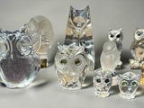 a lot of glass figurines of different shapes and sizes