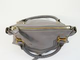 grey leather cross body bag with gold hardware detail
