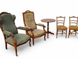 three chairs and a table with a chair and a table
