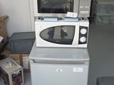 a microwave and a microwave oven sitting on top of each other