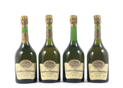 trois bouteilles de champagne posées les unes à côté des autres sur une surface blanche
