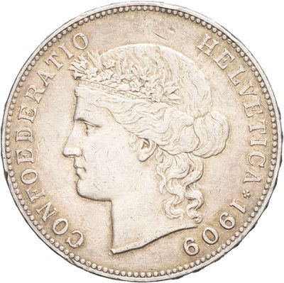 a close up of a coin with a woman ' s head on it