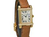 a close up of a wrist watch with roman numerals on it