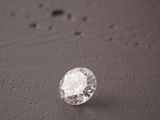 a close up of a single diamond on a table