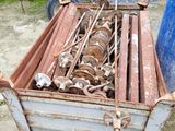 a metal box with a bunch of rusty items inside of it