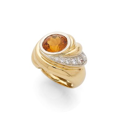 an orange sapphire and diamond ring, by van cleef