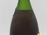 a bottle of wine that is sitting on a table
