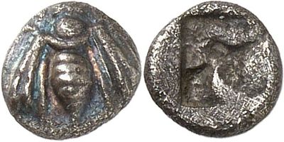 a silver coin with an image of a woman on it