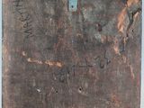 an old suitcase with writing on it sitting on a table