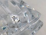 a clear piece of glass that is sitting on a table