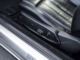 a close up of a seat in a car with a remote control