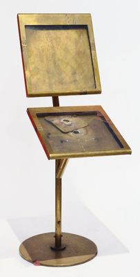 a small table with a clock on top of it