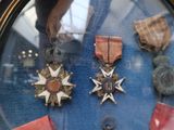a display of medals and medals on display in a glass case