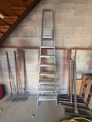 a ladder leaning up against a wall in a garage