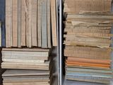 two bins full of old books on a shelf