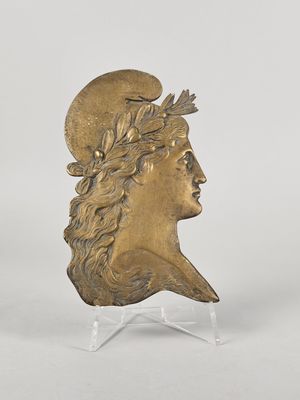 a gold bust of a man with a crown on his head