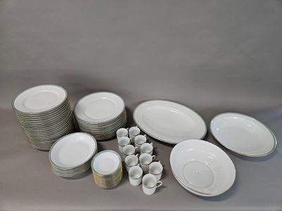 a lot of plates and cups sitting on a table