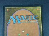 a close up of a magic the gathering card on a table