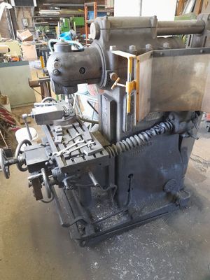 a machine that is sitting on a table in a garage
