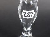a clear glass owl figurine with a number on it