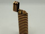 a lighter that is sitting on a white surface