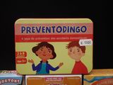 several children ' s board games are stacked on top of each other