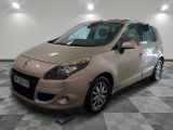 a picture of a beige car parked on a checkered floor