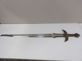 an image of a sword on a table with a bird on it