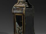 an antique clock with a bird on top of it sitting on a table