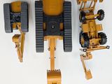 three toy vehicles that are sitting on a white surface