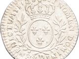 a silver coin with a crown on top of it