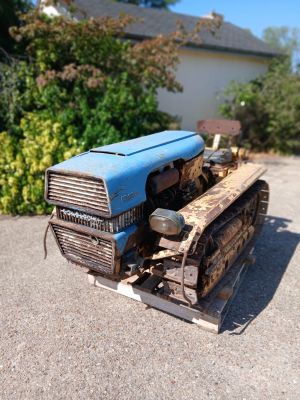 a toy tractor that is sitting on the ground