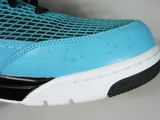 a close up of a pair of shoes on a white surface