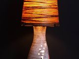 a lamp that is sitting on a table with a lamp on it