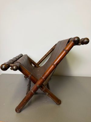 a wooden chair that is on top of a table
